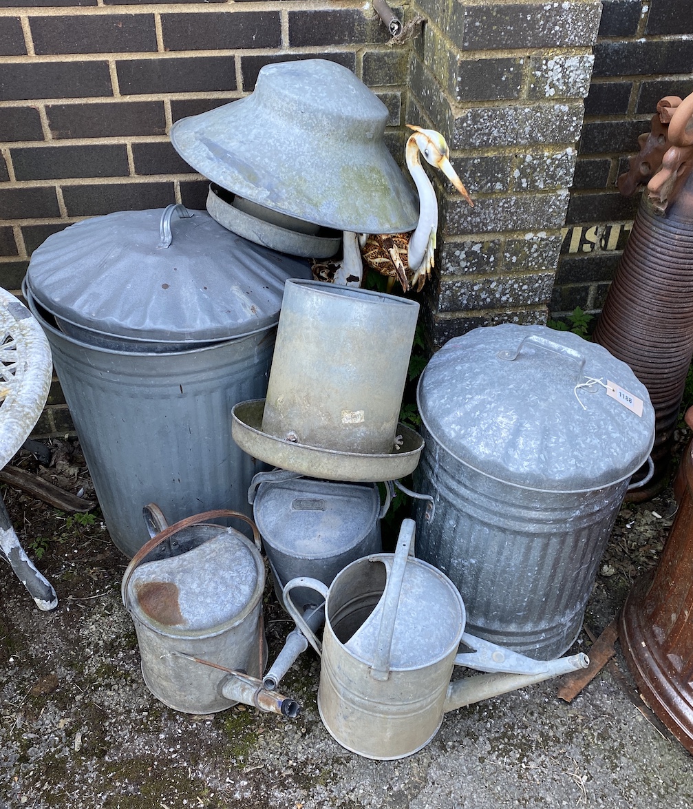 A quantity of galvanised bins, watering cans, feeder etc